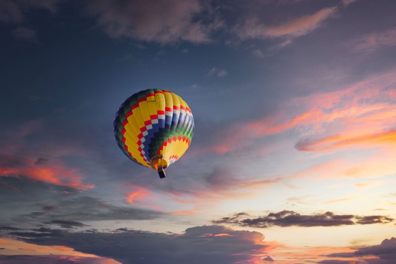 Hot air balloon over mountains
